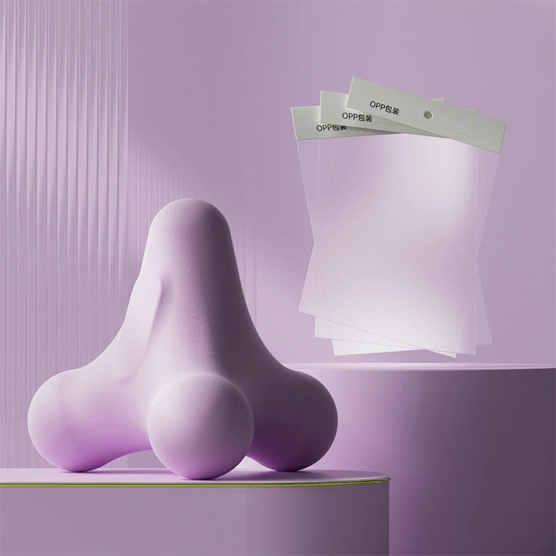 Abstract purple massage tool beside semi-transparent OPP bags in modern pastel-themed layout
