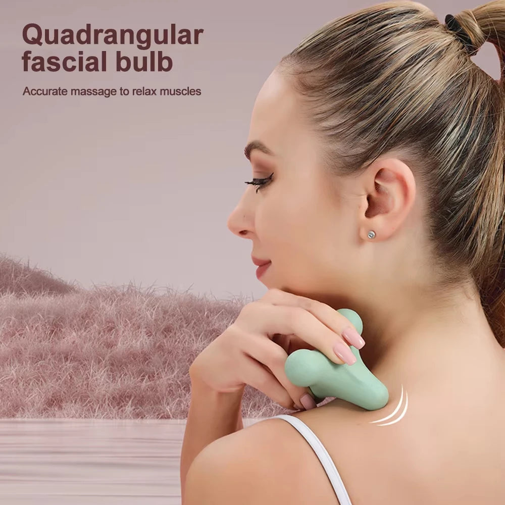 Person using green quadrangular fascia bulb on upper back for muscle relaxation in a serene setting